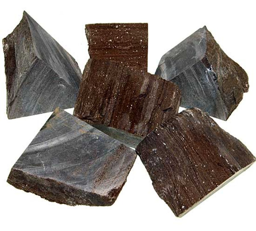 Verschiedene Rohsteine von fossile Holz, mit kristallinen Oberflächen